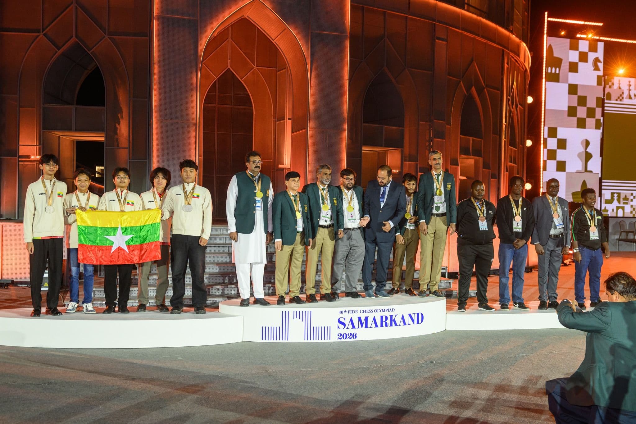 Kenya on the podium: The Kenyan Open National Team celebrating their Bronze Medal in Category D.