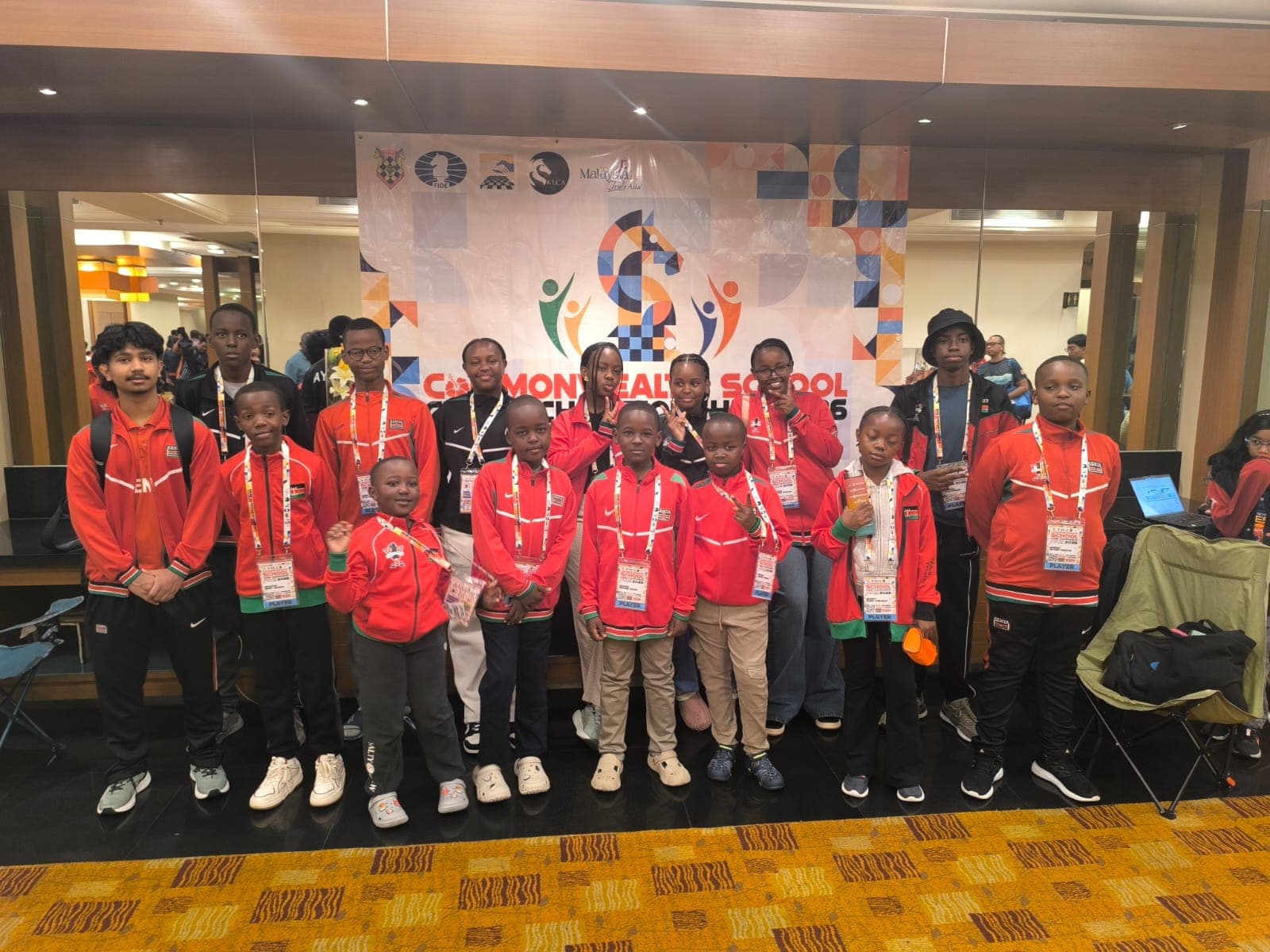 African youth chess delegations from Namibia and Kenya celebrating together at the championship.