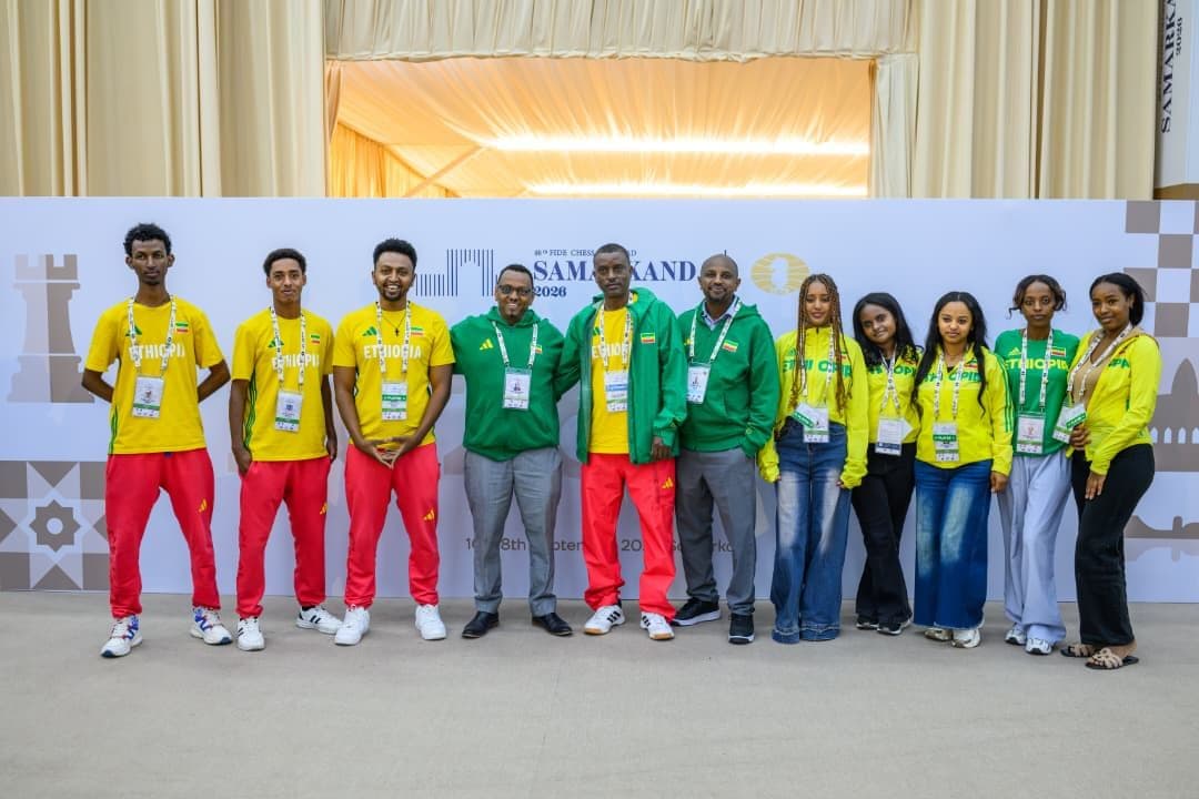 Team captains, delegates, and national arbiters conferring in the delegation area.